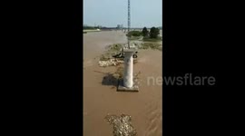Helicopter rescues fishermen trapped on island in flooded river