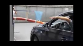 Toll gate staff uses fishnet to receive money from drivers