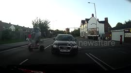 Reckless Quad Biker and Biker pull wheelies without helmets in Birmingham, UK - Rear View