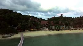 Watch the sunset above Coconut Beach in Koh Phangan Thailand by Drone