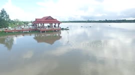 Flying a drone over Little temple in Surat Thani Thailand