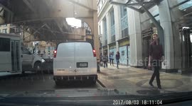 Charter bus drags car along the road
