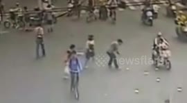 Good samaritans help man pick up bank notes blown away in wind