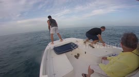 Fisherman topples over and falls off boat into the sea