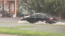 Cars driving through flood waters on St Claude Avenue New Orleans 9th ward
