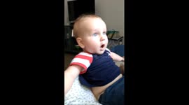 Baby's jaw dropping reaction to dad shaving beard