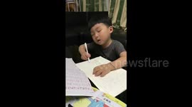 Cute kid falls asleep while doing homework
