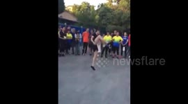 Talented girl kicks shuttlecock while skipping
