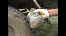 Helmet saves motorcyclist's life after he is hit by a flying rock