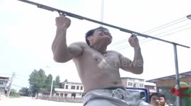Kung fu master does pull-ups with middle fingers