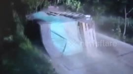 Car narrowly escapes being crushed when truck flips