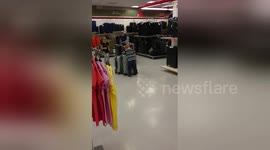 two kids using suitcases as a toys in TK-Maxx