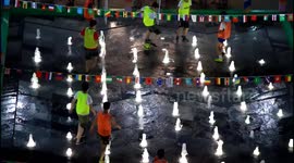 People play football in fountain during heat wave