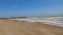 Seagull strugglng to fly in high winds Hastings East Sussex UK