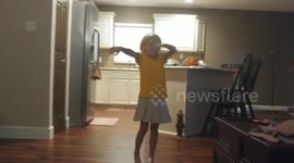 Dad photobombs daughter while she practices dabbing