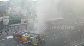 Firemen Extinguishing Bus on Fire at Finchley Road London