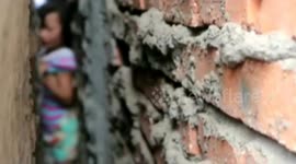 Firefighters rescue girl stuck in wall gap