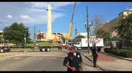 General Robert E. Lee statue is lowered to a truck  by construction crew after removal New Orleans