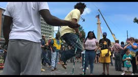 Crowd celebrating with jump rope games during removal of Robert E Lee statue