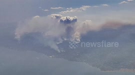 Flying over a huge wildfire near Athens, Greece
