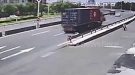 Terrifying moment boy almost gets run over by lorry