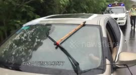Police in China pull over man wiping windsceen by hand