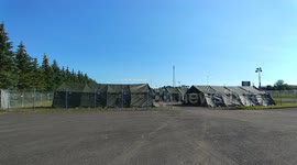 Steadycam tour of tent camp built by military to accomodate Canada / USA border migrants