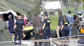 Asylum seekers standing by and arriving at make shift camps at Canada / USA border