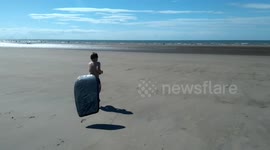 Running into the sea with flying surfboard!