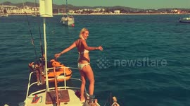 Hot blonde jumping of boat