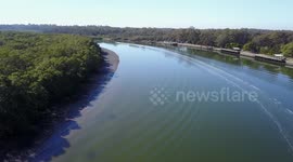 Speed Boat going down a river
