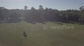 motobike driving through a field
