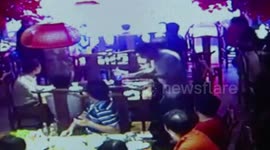 Huge rat falls from ceiling onto restaurant table