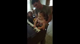 Cute Baby playing piano