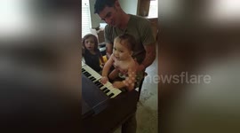 Newsflare Edit - Cute Baby playing piano