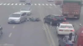 Lucky escape as biker comes inches from having his head run over