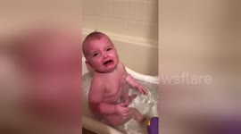 Baby is terrified by mother's face mask