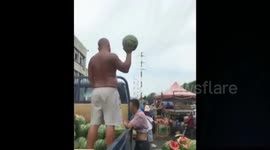 Chinese vendor catches watermelons with one hand