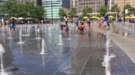 Children play in water spouts