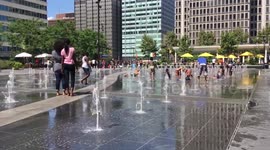 Children play in water spouts