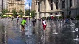 Children play in water spouts