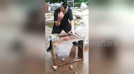 Kung fu master straightens wrench with his bare hands