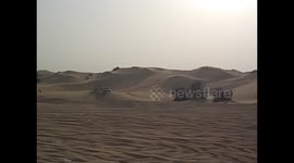 United Arab Emirates. UAE. Safari Desert. 4x4 cars running in the dunes. 2016