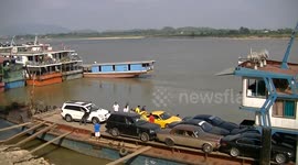 Luxury Cars loading onto a Chinese Freighter,time lapse