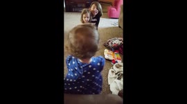 Baby walks to sisters for the first time
