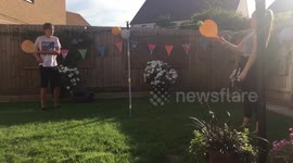 Labrador chasing swingball