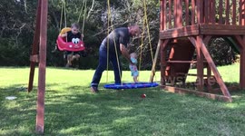 Grandpa swinging a baby makes her fall over accidentally