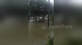 Man rides jet ski in Houston flood during Hurricane Harvey