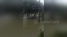 Man rides jet ski in Houston flood during Hurricane Harvey