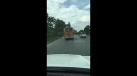 Indian school children pull risky stunt on bus roof  - police probe follows